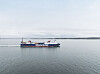 Et Stena Line-fartøy seiler på rolig sjø under en overskyet himmel.