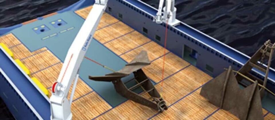 Anchor handling cranes shifting heavy anchors on deck.